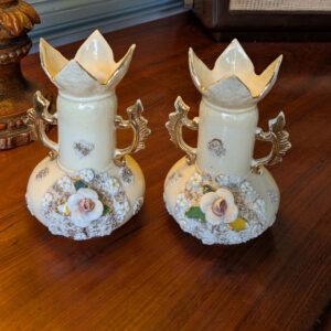 PC79 pair of cream ceramic vases with applied flowers, gilt handles and petal-shaped rims, front view