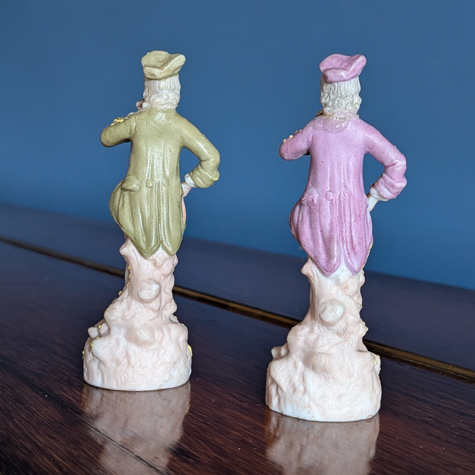 Rear view showing the green and pink coats and moulded bases